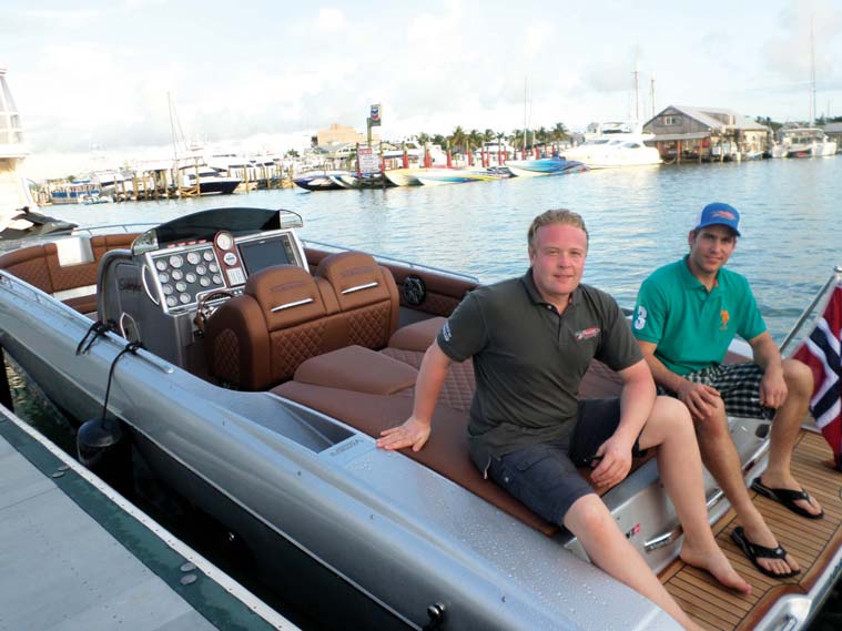 Predator Performance Boats president Andree Bakkegaard shows the 377 Supersport to powerboat enthusiast Erik Eriksen during the offshore world championships in Key West.