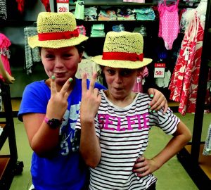 Price’s granddaughters Courtney and Summer hamming it up on during a pocketbook and shoes shopping spree.