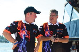 Rick Merola (right) talks details with transport specialist Milton Calafell, who has been with the team since 2007